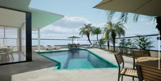 Piscina externa com área de lazer e palmeiras em Lajeado.
