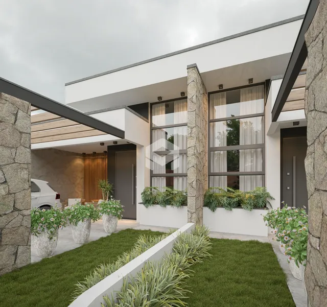 Fachada moderna de uma residência com jardim e área externa em Lajeado.