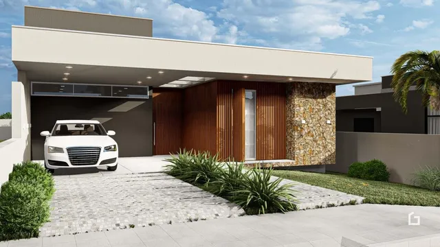 Fachada moderna de uma residência em Lajeado, Brasil, com garagem e paisagismo.