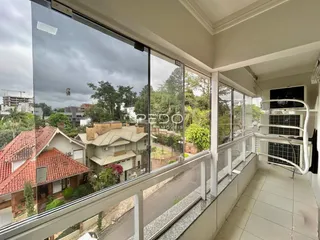 Vista da varanda com vista para casas e vegetação na Lajeado.