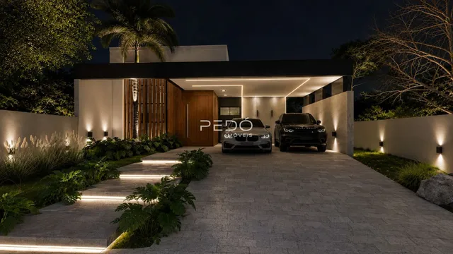 Fachada moderna de uma residência com paisagismo à noite.