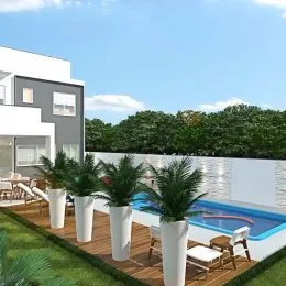 Foto externa mostrando uma piscina com vegetação ao fundo.