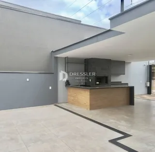 Vista da cozinha moderna em um ambiente aberto.