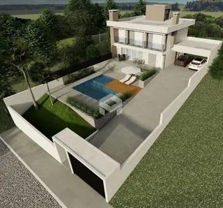 Vista externa de uma residência moderna com piscina e jardim em Lajeado.