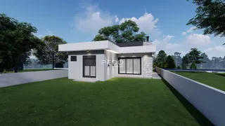 Fachada moderna de uma casa em Lajeado, Brasil, com jardim gramado.