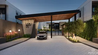 Vista externa de uma residência moderna com portico coberto e paisagismo em Lajeado.