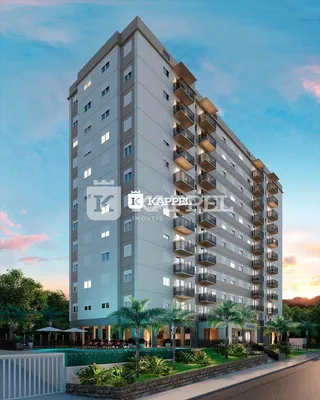 Fachada de um prédio residencial moderno em Lajeado, Brasil, com múltiplos andares e varandas.