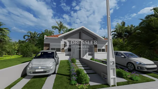 Fachada de uma casa em Lajeado, Brasil, com jardim e carros estacionados na frente.