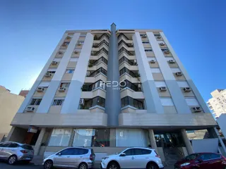 Fachada de um prédio residencial em Lajeado, Brasil com apartamentos e unidades externas.