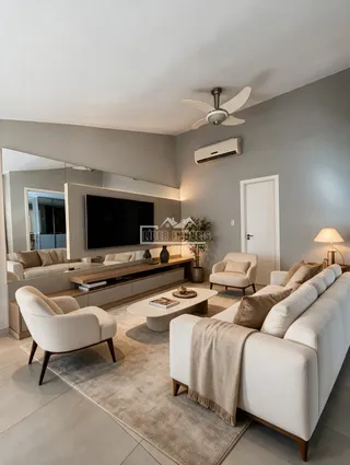Sala de estar moderna com sofá e poltronas em um ambiente claro.