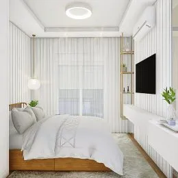 Foto de um quarto com cama e cortinas brancas.