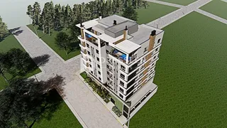 Vista aérea de um edifício residencial em Lajeado, Brasil, cercado por árvores e gramado.