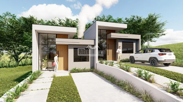 Fachada moderna de uma casa em Lajeado, Brasil, com jardim.