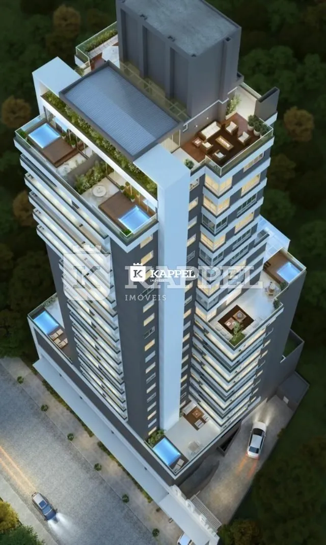 Vista aérea de um edifício residencial alto em Lajeado, Brasil, mostrando suas varandas e estrutura.
