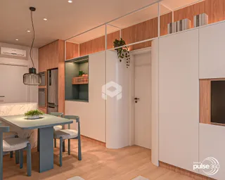 Ambiente moderno de sala de jantar e cozinha em um imóvel.