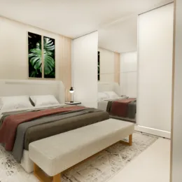 Quarto com cama e paredes brancas em um imóvel.
