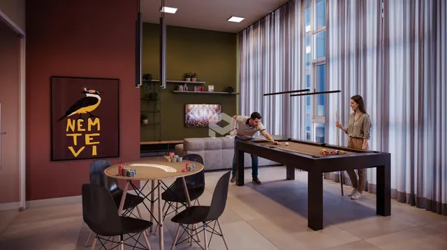 Sala de estar com mesa de sinuca e decoração moderna.
