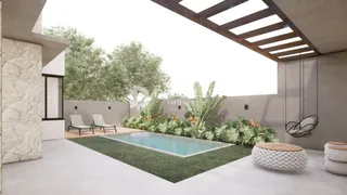 Vista externa de uma área de piscina e jardim em uma residência.