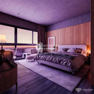 Quarto com grande janela e decoração moderna.