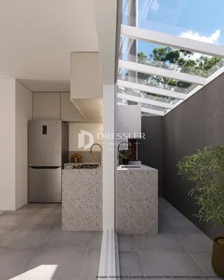 Interior moderno de uma cozinha com ilha e grandes janelas em Lajeado.