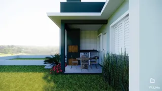 Fachada de uma casa moderna com jardim em Lajeado, Brasil.