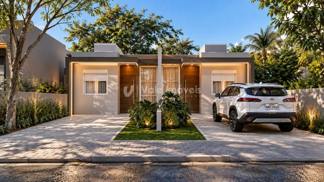 Fachada de uma residência em Lajeado, Brasil, com jardim e entrada pavimentada.