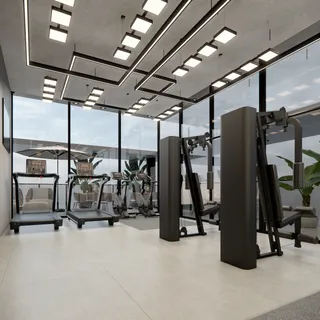 Foto do interior de uma academia moderna com equipamentos de musculação.