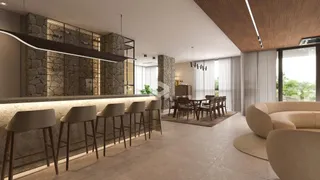 Ambiente moderno com balcão e sala de estar em um imóvel no Brasil.