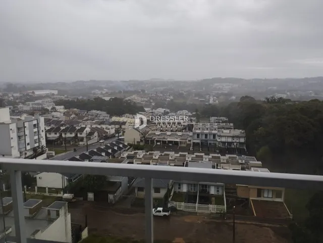 Vista panorâmica de uma área residencial em Lajeado, Brasil, com paisagem urbana ao fundo.
