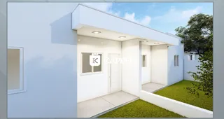 Fachada externa de uma casa moderna branca com jardim em Lajeado.