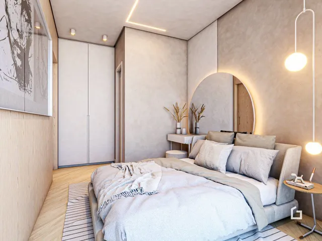 Quarto moderno com cama e armários em um apartamento.