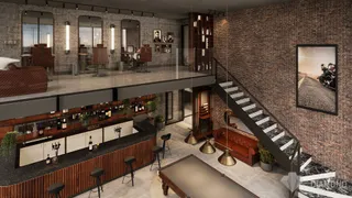 Vista de um loft moderno com paredes de tijolo aparente e escadaria.
