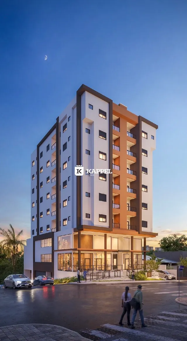 Fachada moderna de um prédio residencial em Lajeado, Brasil, com vários andares e varandas.
