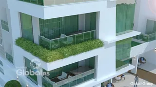 Fachada moderna de um edifício residencial em Lajeado, Brasil com terraços verdes.