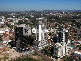 Vista aérea de um bairro urbano em Lajeado, mostrando múltiplos edifícios residenciais.