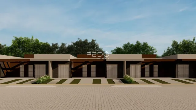 Fachada de uma residência com garagem e paisagismo em Lajeado.