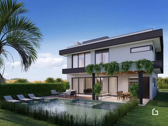 Fachada moderna de uma casa com piscina e jardim em Lajeado.