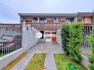 Fachada de um prédio residencial em Lajeado, com um pátio externo.
