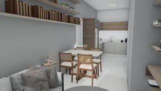 Ambiente interno com sala de jantar e cozinha em um imóvel.