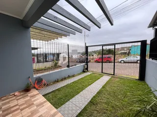 Vista do quintal de uma propriedade em Lajeado, Brasil com cerca e portão.