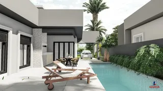 Vista externa de uma propriedade com piscina e jardim em Lajeado.