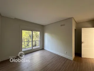 Sala de estar com vista para a natureza em Lajeado, Brasil.