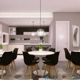 Foto de uma sala de jantar e cozinha com mesa e balcão em um imóvel.