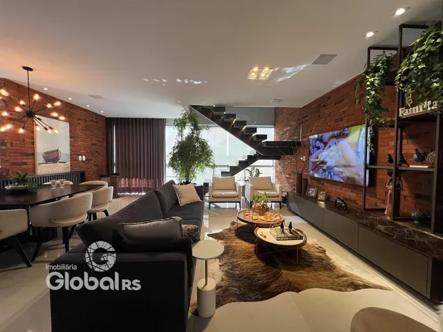 Sala de estar com decoração moderna e paredes de tijolo aparente.