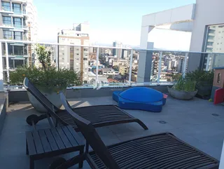 Vista da varanda de um apartamento em Lajeado, Brasil com móveis de exterior.