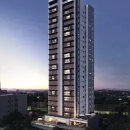 Fachada de um prédio residencial alto em Lajeado, Brasil, capturada ao entardecer.