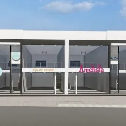 Fachada de um prédio comercial com grandes painéis de vidro.