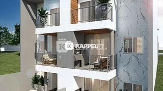 Fachada de um prédio residencial moderno com varandas em Lajeado, Brasil.