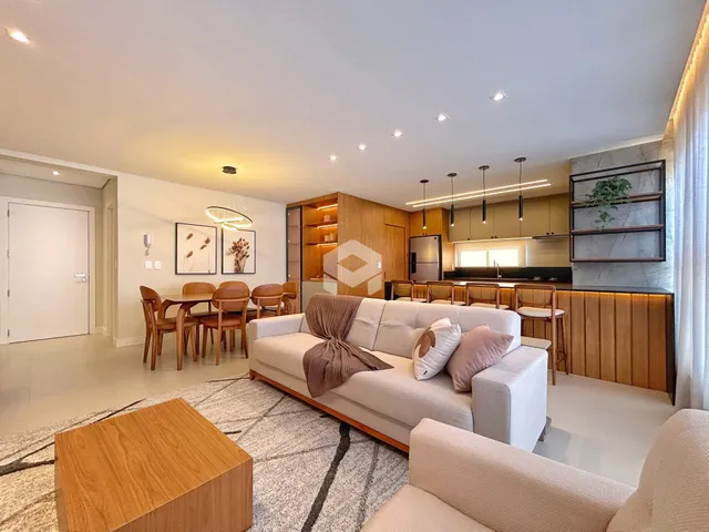 Sala de estar e cozinha de um apartamento moderno em Lajeado.