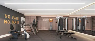 Imagem de um ambiente interno de academia com equipamentos de ginástica.